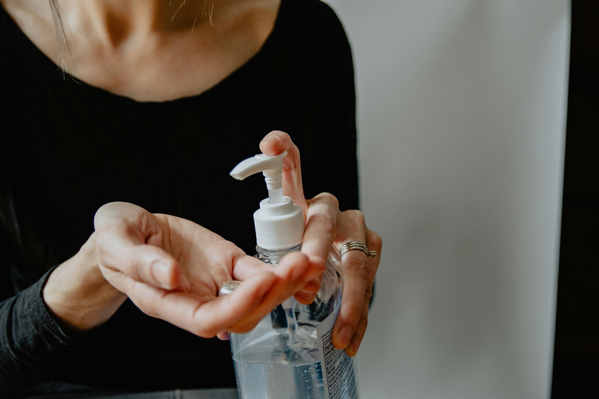 A person using hand sanitizer on their hands