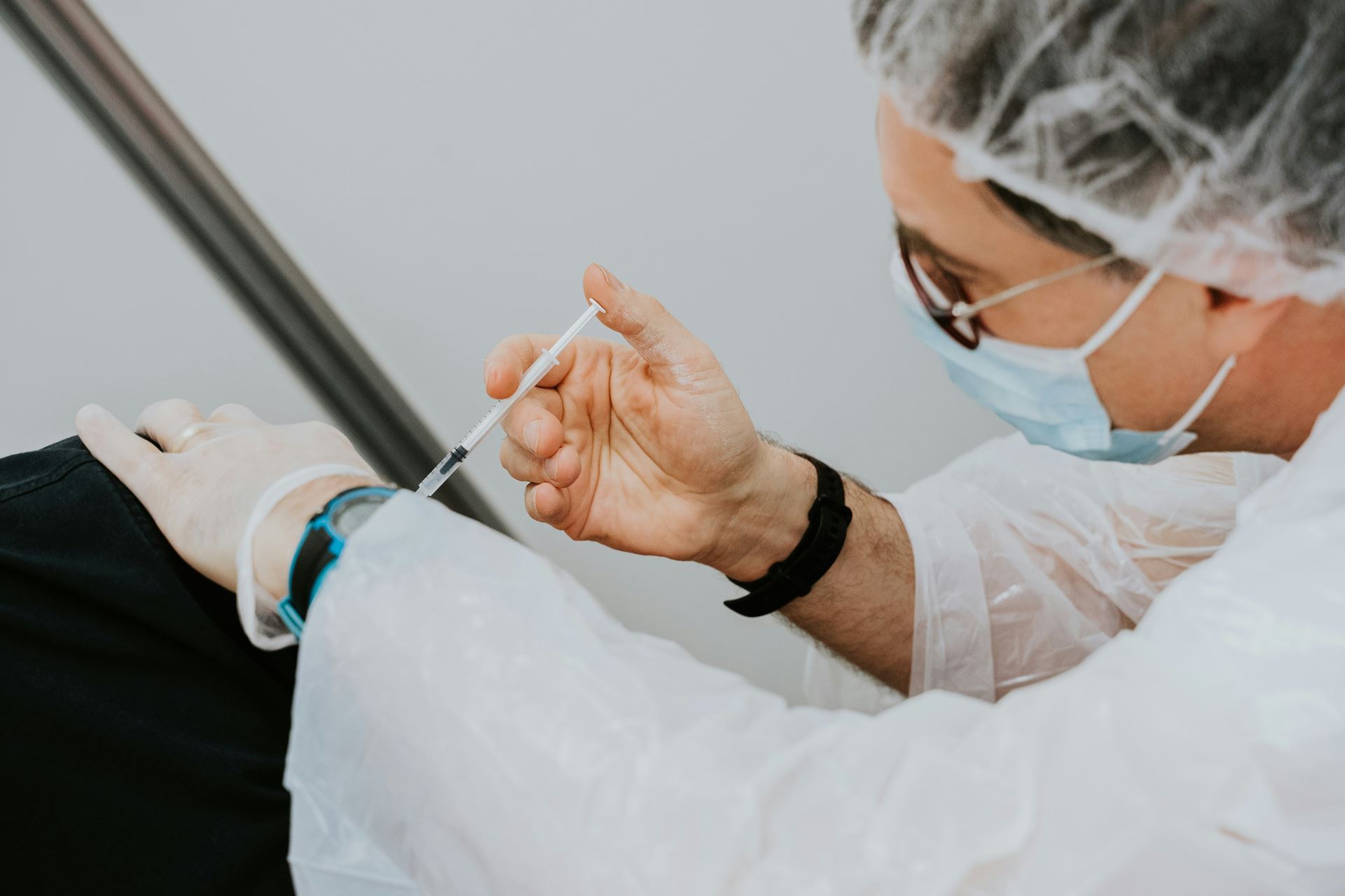 A person being administered a vaccination